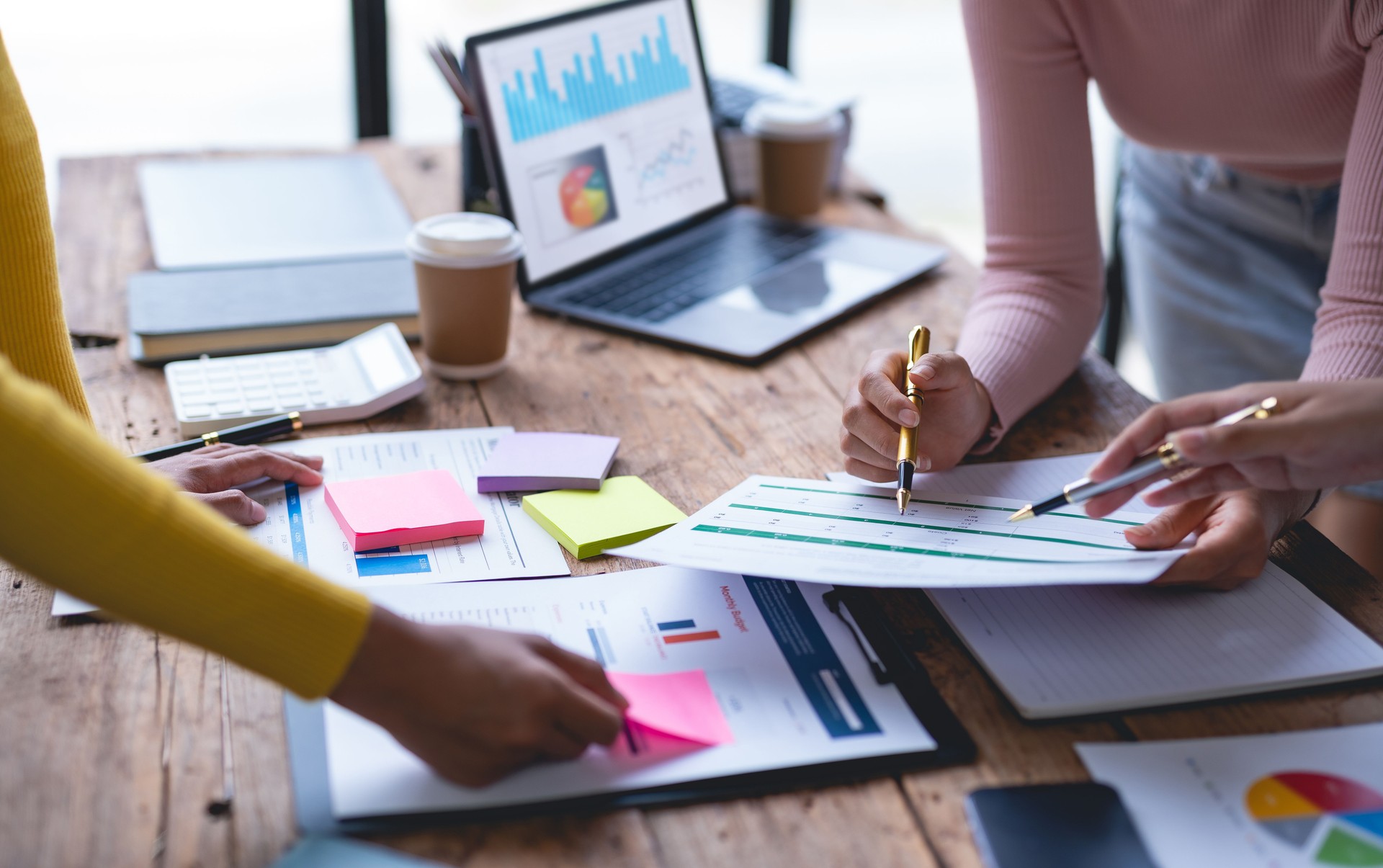 Group of business people are meeting to analyze data for marketing plan. Businessmen meeting about business project, marketing, presentation and brainstorming for company profit.